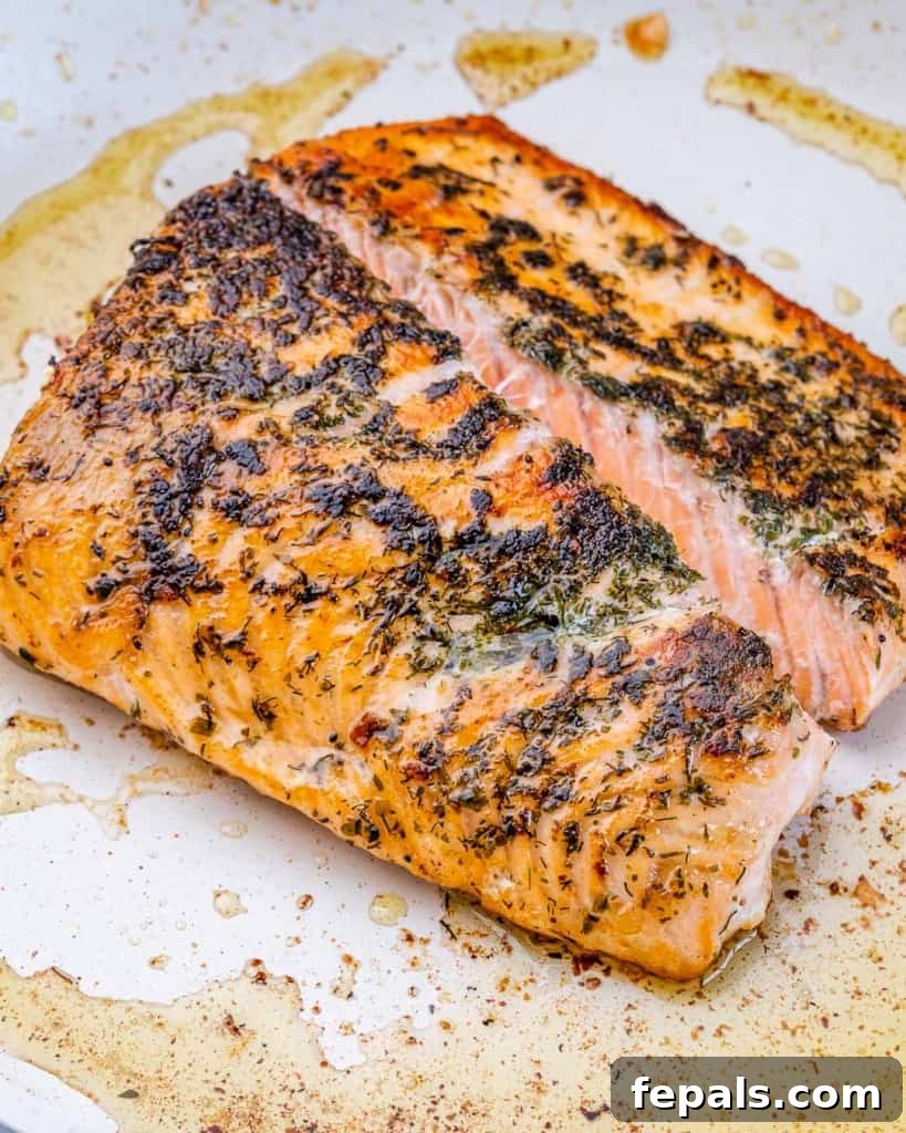 Savory Salmon Pesto Pasta 6 Seared salmon in a pan.