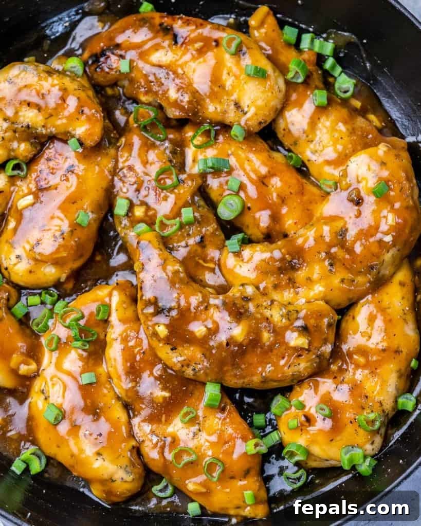 Chicken cooked with a sauce in a pan.