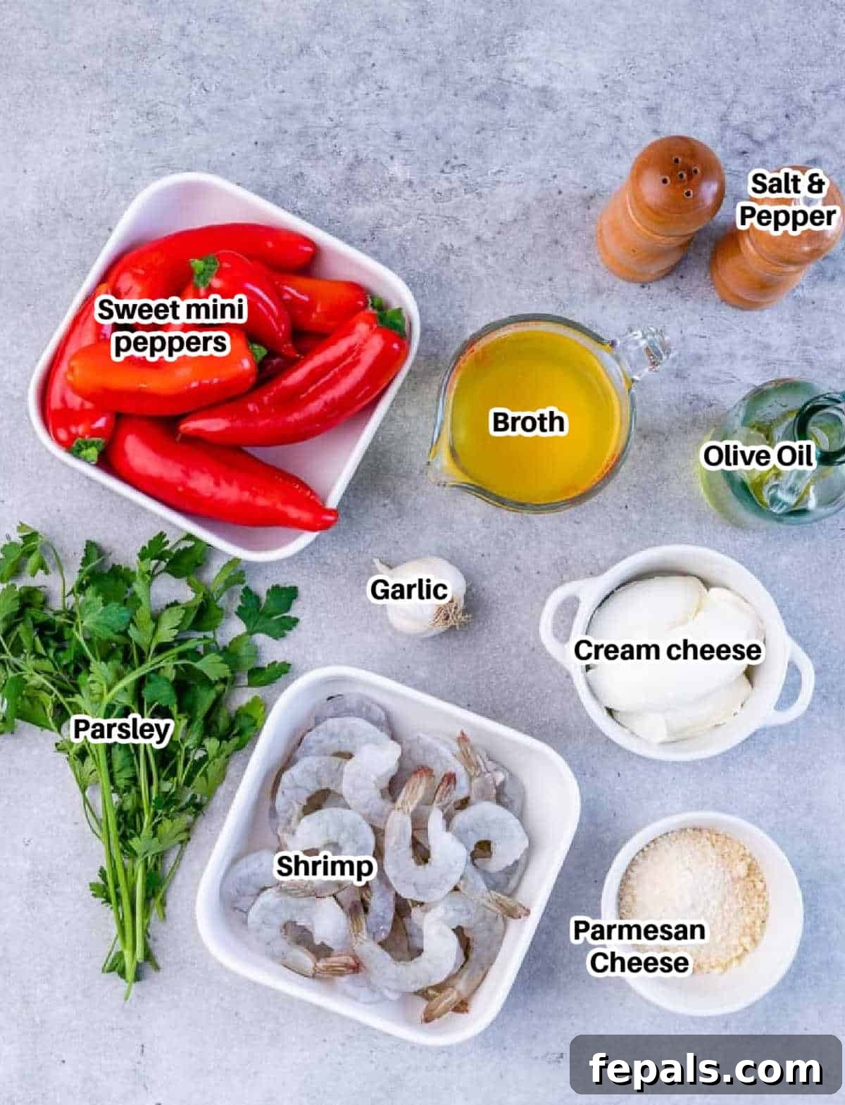 Luscious Garlic Shrimp Skillet Feast 4 A flat lay image displaying all the ingredients for creamy garlic shrimp laid out on a white surface.
