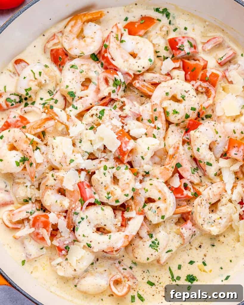 Luscious Garlic Shrimp Skillet Feast 8 Garnishing a pan of creamy garlic shrimp with fresh parsley and freshly grated Parmesan cheese.