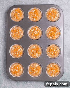 Muffin batter in a muffin pan.