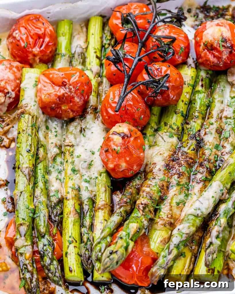 Cheesy roasted asparagus and cherry tomatoes.