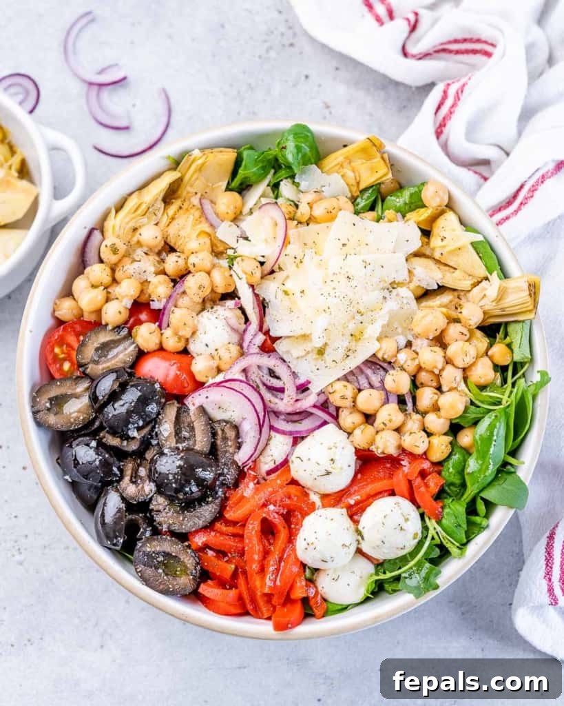 Classic Antipasto Salad 8 A beautifully composed Antipasto Salad presented in a large, elegant bowl, showcasing its rich array of ingredients and vibrant colors before being tossed.