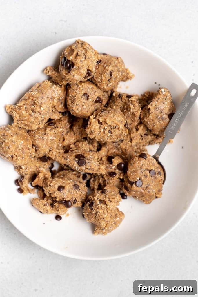 cookie dough being formed into balls
