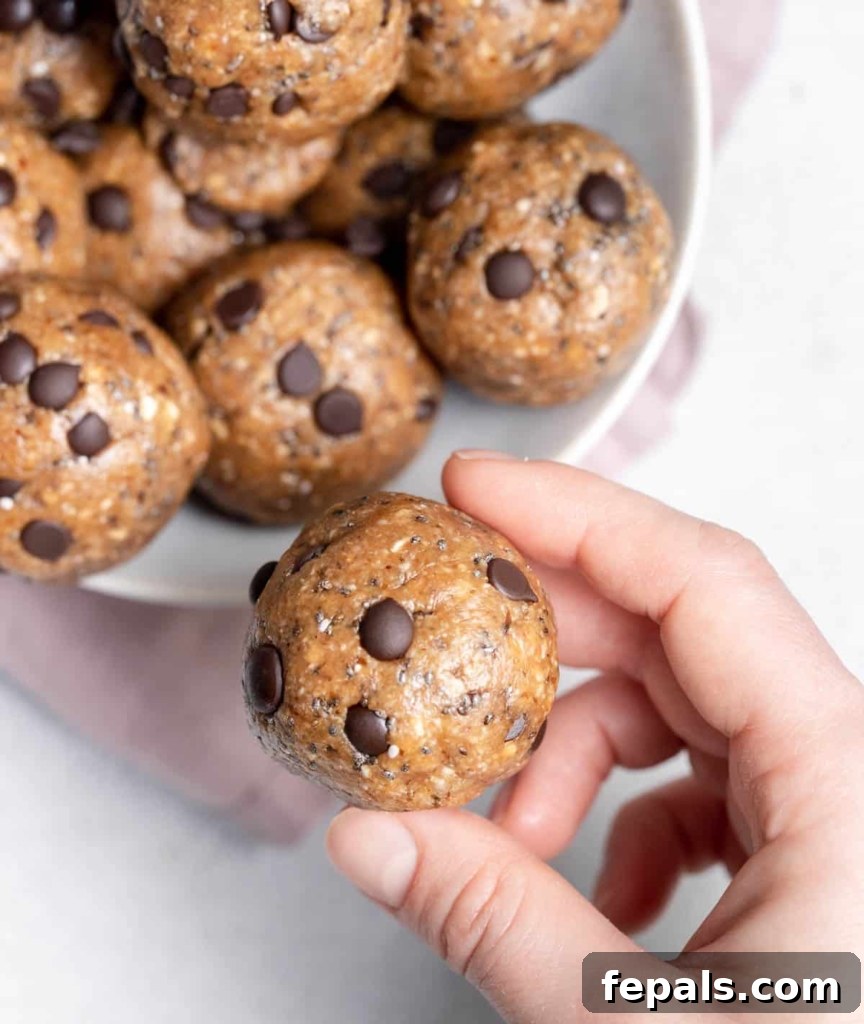 hand holding cookie dough ball