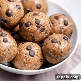 side shot of cookie dough balls on a round white plate