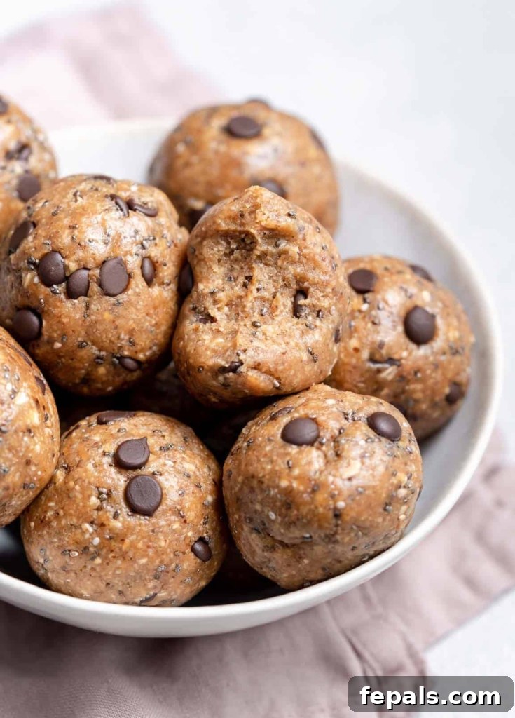 side shot of energy balls on a white plate