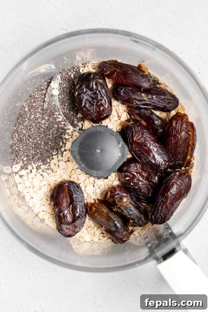 dates, oats, and chia seeds in a food processor