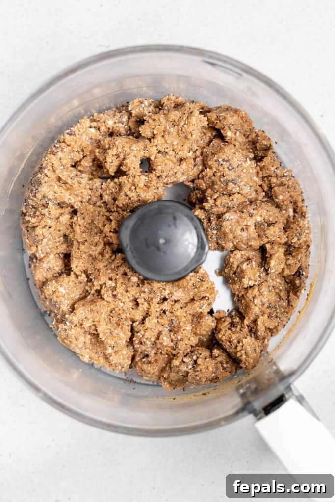 blended oats dates and nut butter in a food processor