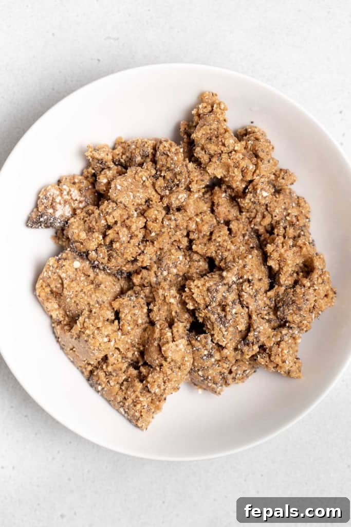 cookie dough blended mixture added onto a round white plate