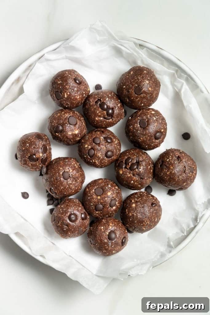 Decadent Double Chocolate Date Energy Bites 12 Top view of energy balls arranged on a round plate, ready to be picked up and enjoyed.