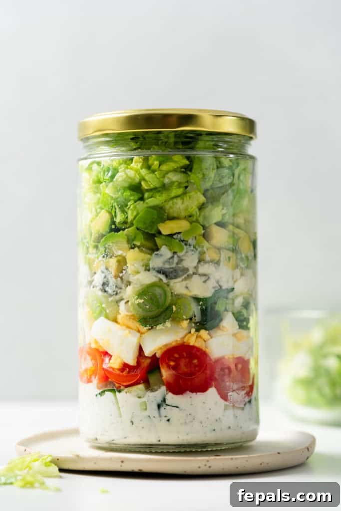 Plant-Powered Cobb Salad 12 Vegetarian cobb salad jar closed with a gold lid.