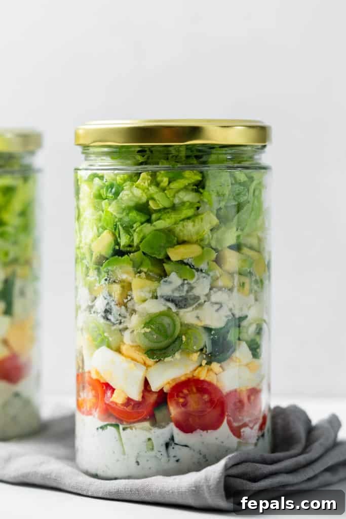 Plant-Powered Cobb Salad 13 side shot of cob salad in a jar with lid on it