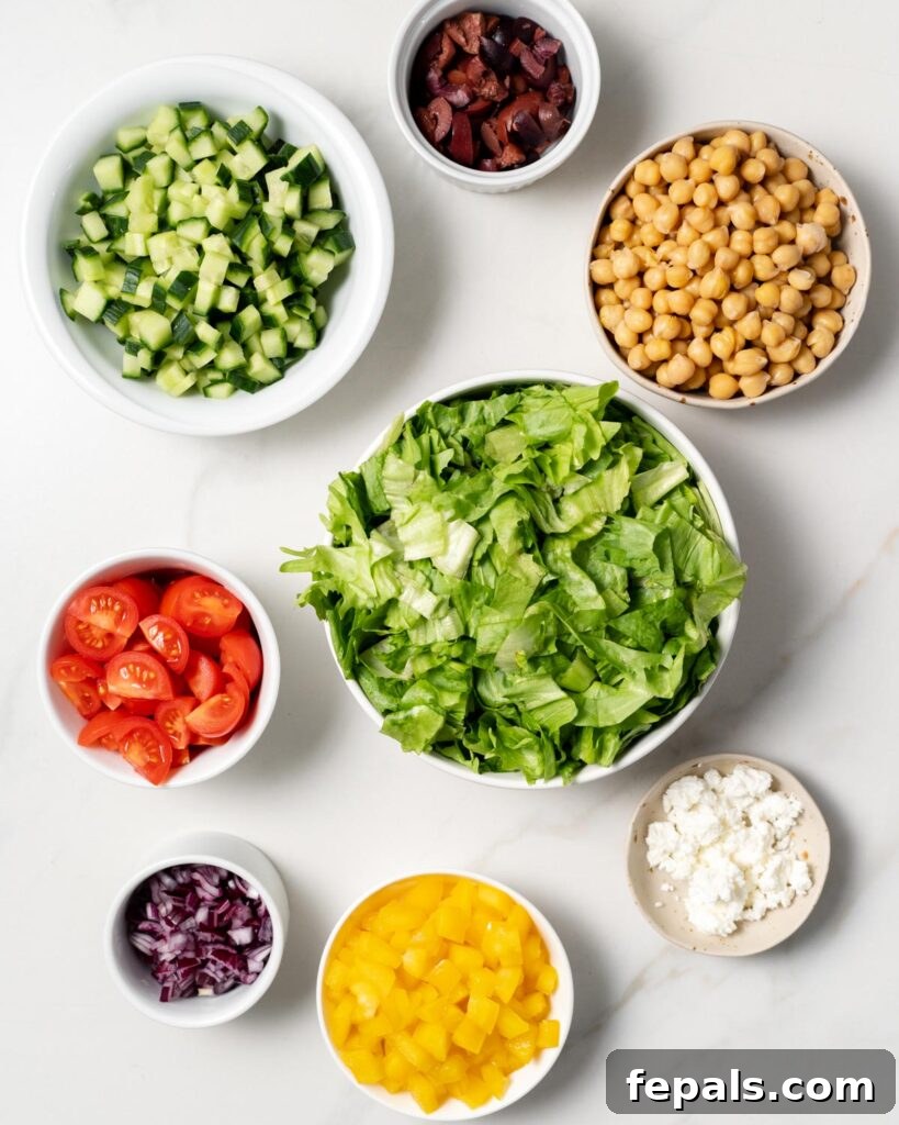 Layered Jar Salads 4 ingredients that goes in the mason jar to make greek salad