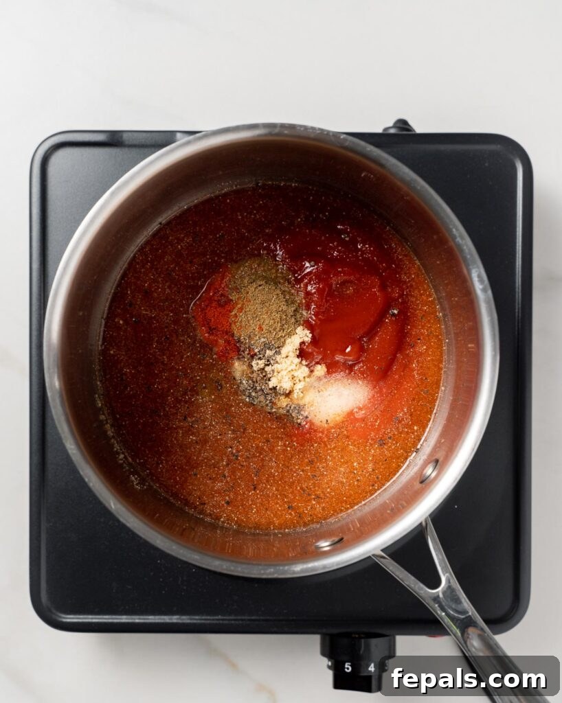 seasonings, ketchup, and vinegar added in a pot