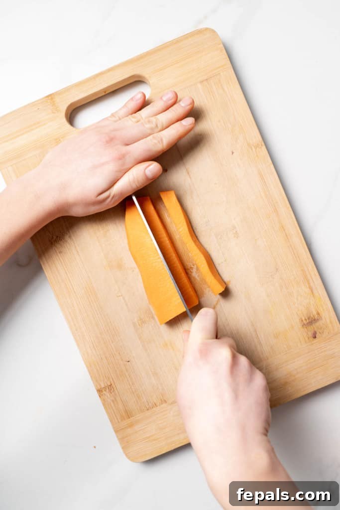 Slicing sweet potato into sticks.