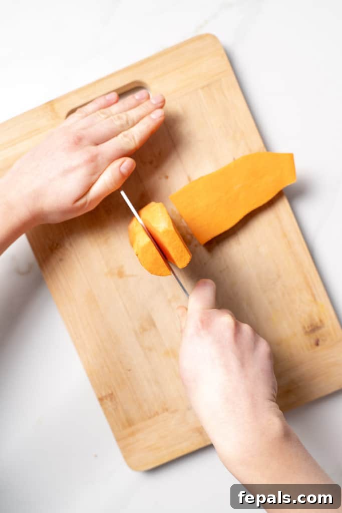Slicing a sweet potato from the top.