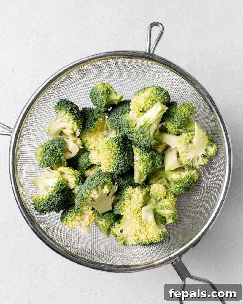 Perfect Stovetop Broccoli 13 raw broccoli in a wired sifter