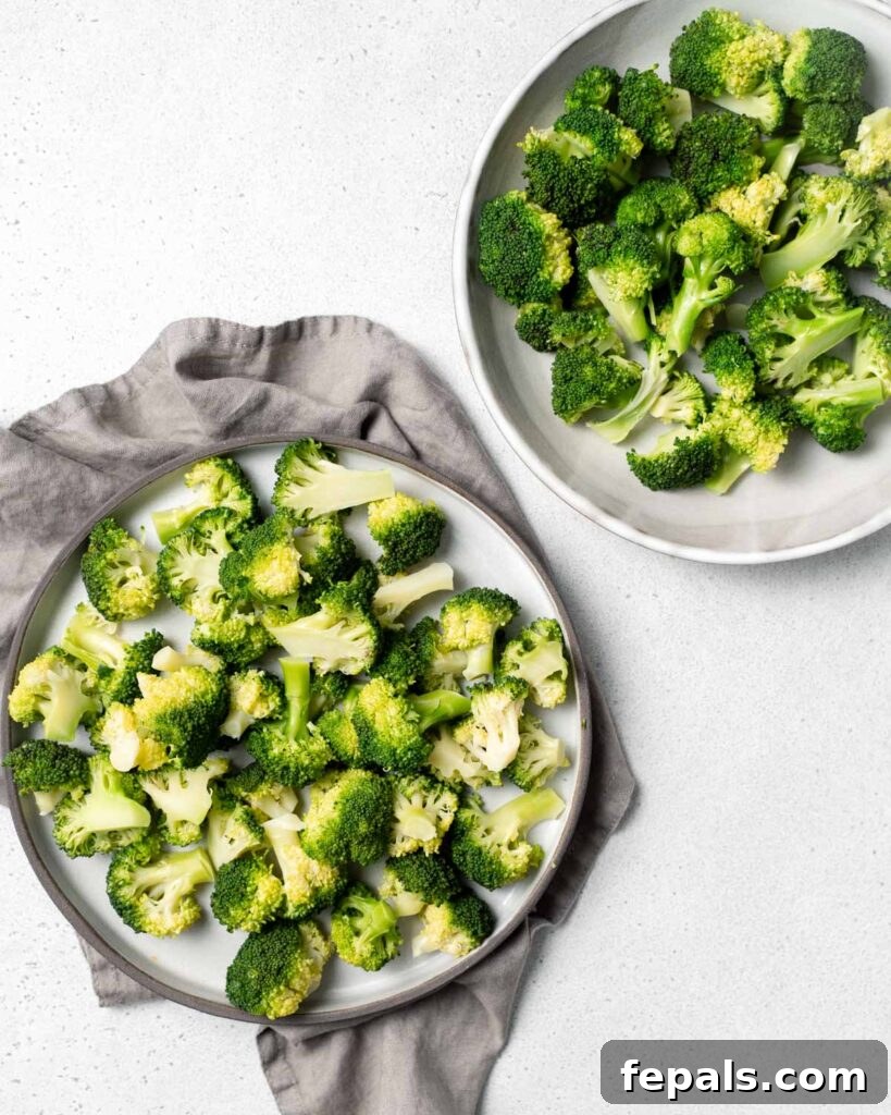Perfect Stovetop Broccoli 17 Plate full of broccoli florets next to a bowl filled with broccoli.