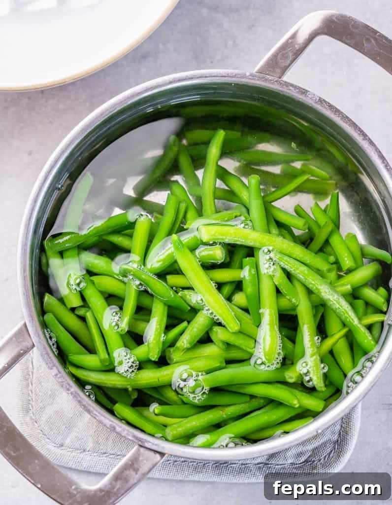 Garlic Sautéed Green Beans 4 Boiling green beans in a large pot.
