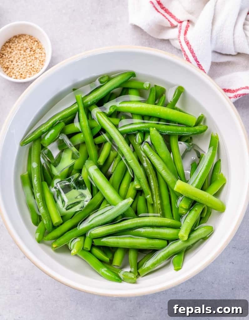 Garlic Sautéed Green Beans 5 Green beans soaking in ice water.