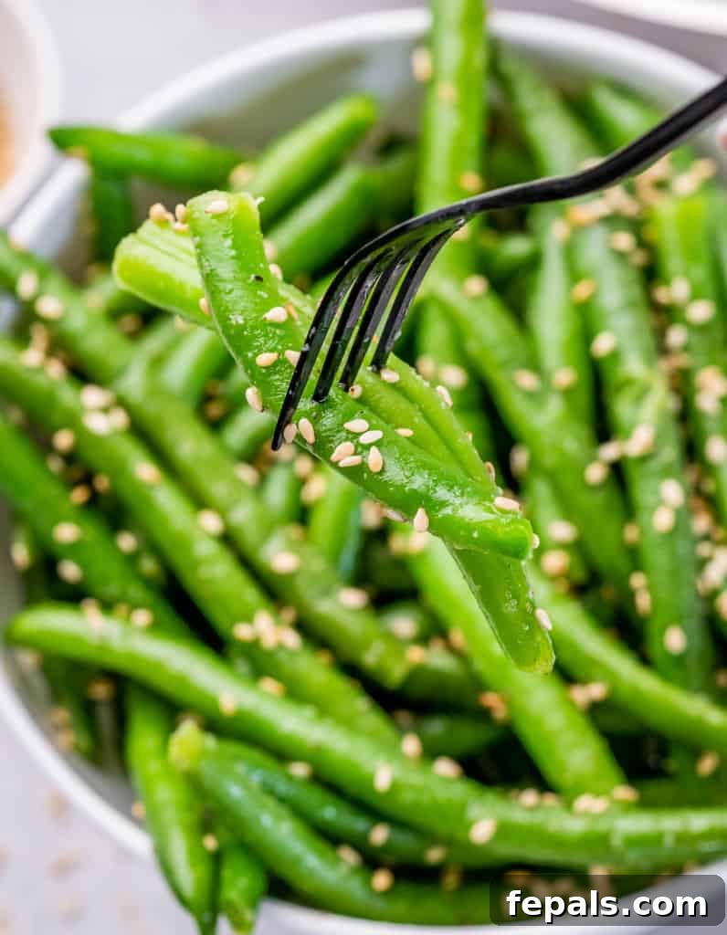 Garlic Sautéed Green Beans 9 Green beans on a fork.