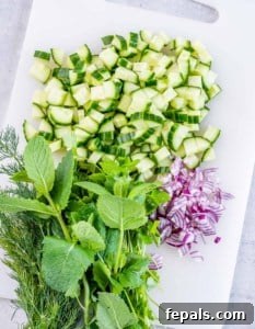 Chopped herbs, cucumber and red onion.