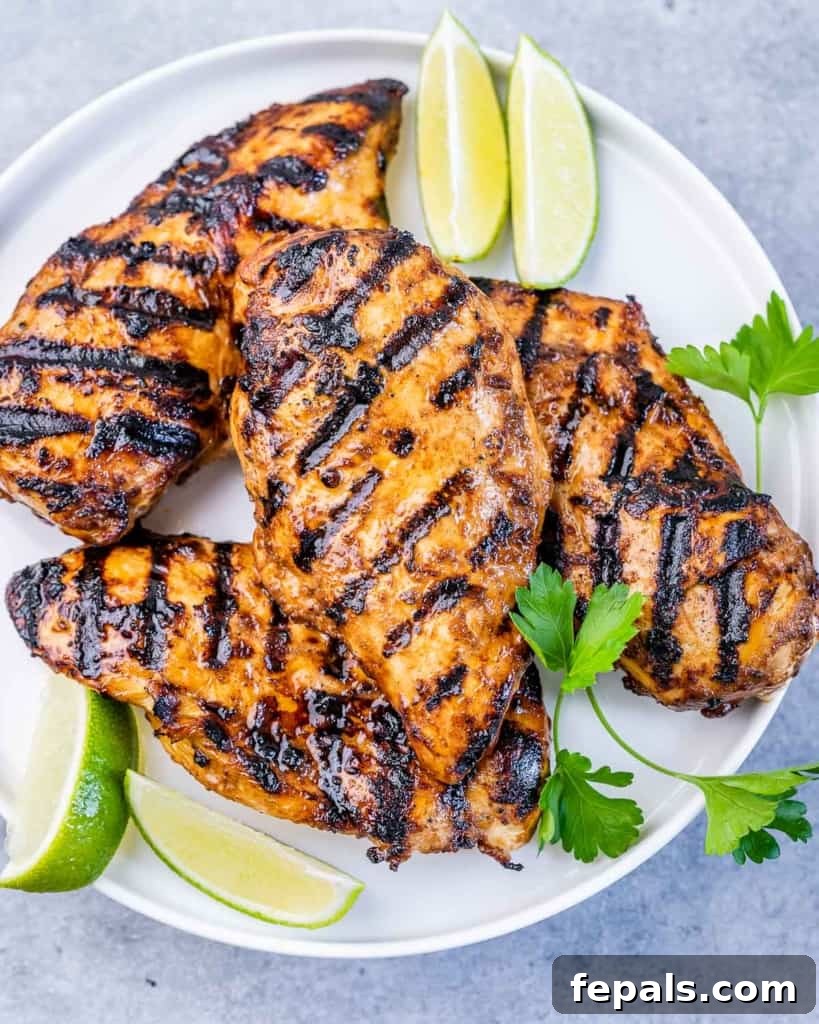 Crispy Honey Chipotle Chicken 8 top view of grilled chicken on a plate with lime slices
