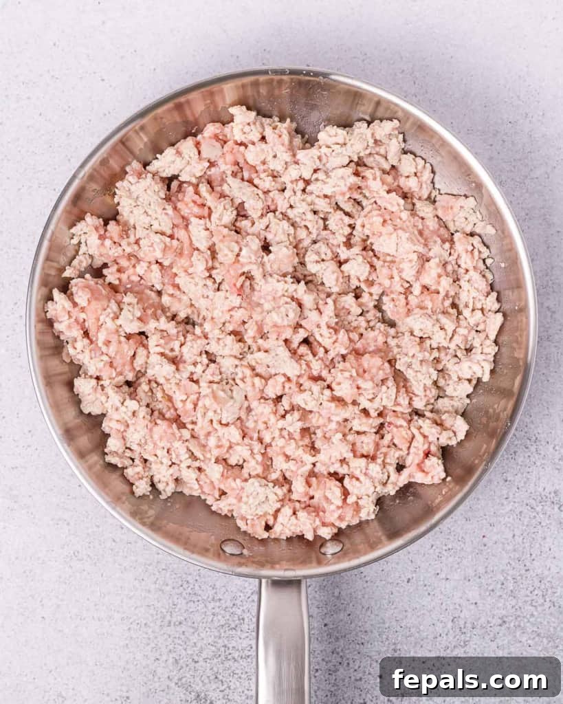 Ready-to-Eat Chicken Taco Bowls 5 sauteed ground chicken in pan