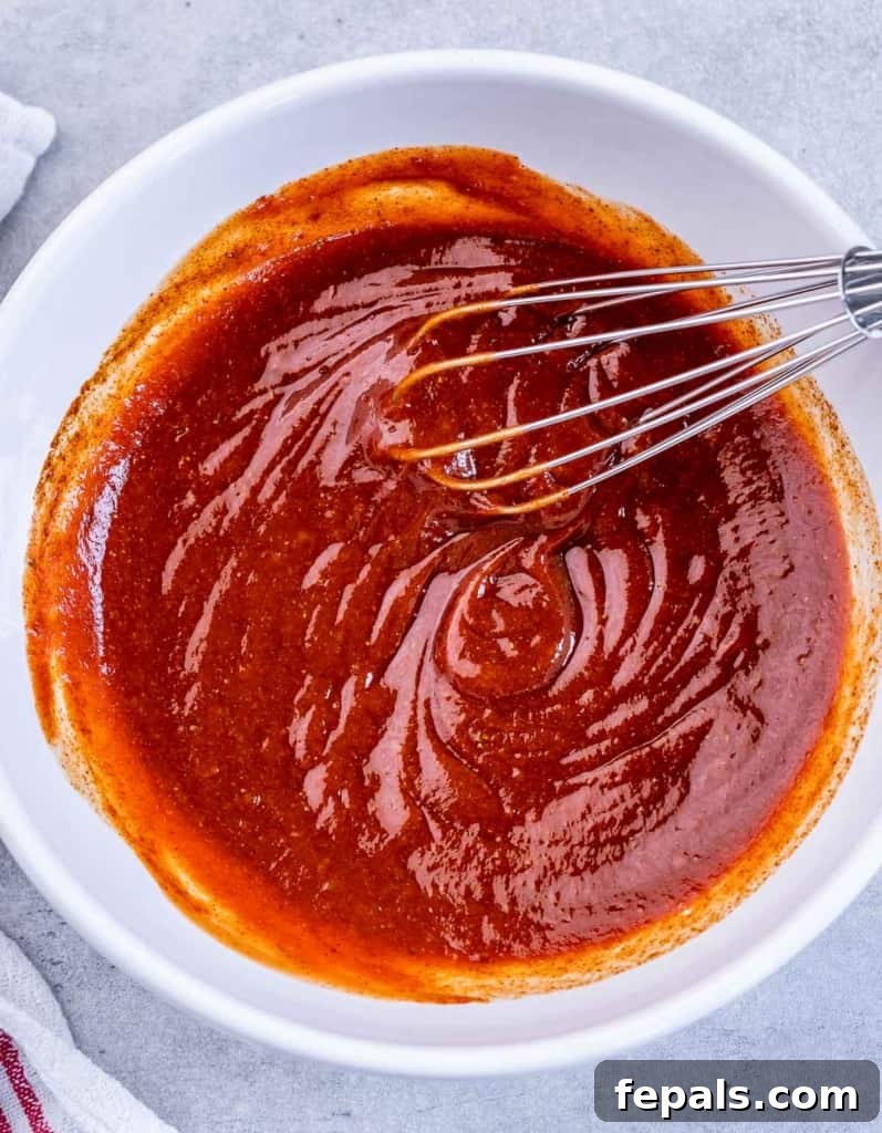 bbq sauce in a bowl with whisk