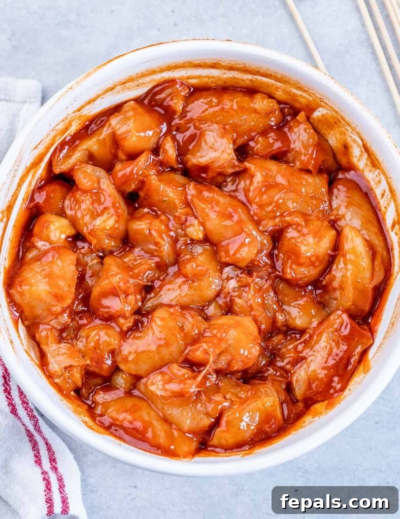 marinated chicken chunks with bbq sauce in a white bowl