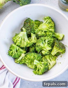 cooked broccoli in a round white bowl