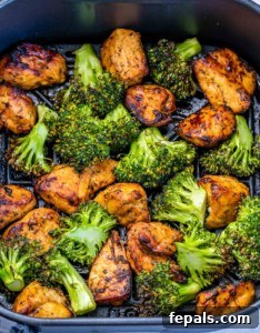 Cooking chicken and broccoli in an air fryer.