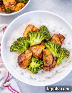 Top view air fried chicken chunks with broccoli and rice.