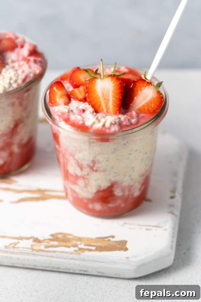 Jars of strawberry and cream protein overnight oats.