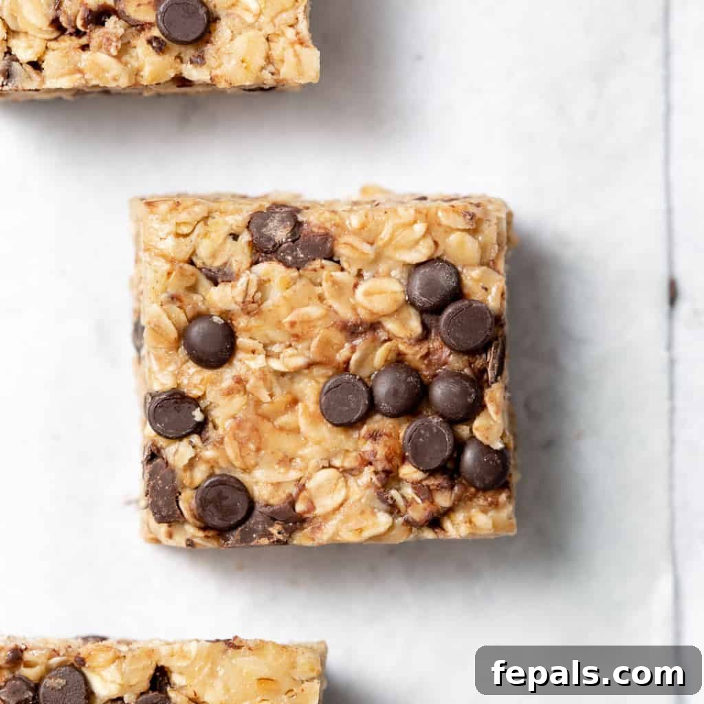A single no bake peanut butter oatmeal bar with visible chocolate chips, a close-up.