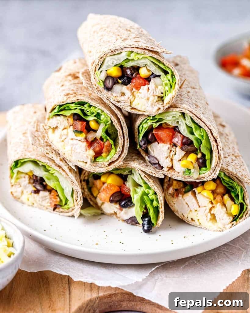 Spicy Southwest Chicken Wrap 13 A side shot of several Southwest Chicken Wraps, stacked enticingly to show their generous fillings.