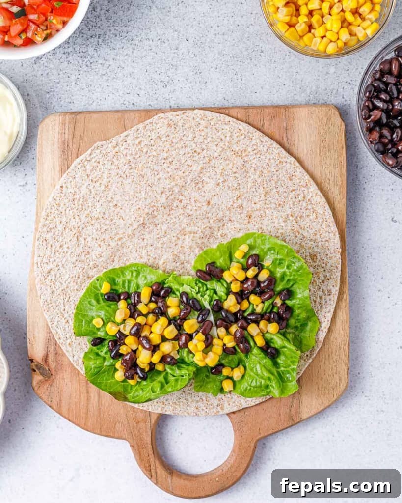 Spicy Southwest Chicken Wrap 8 Sweet corn kernels added over the black beans and lettuce, enhancing the wrap's color and flavor.