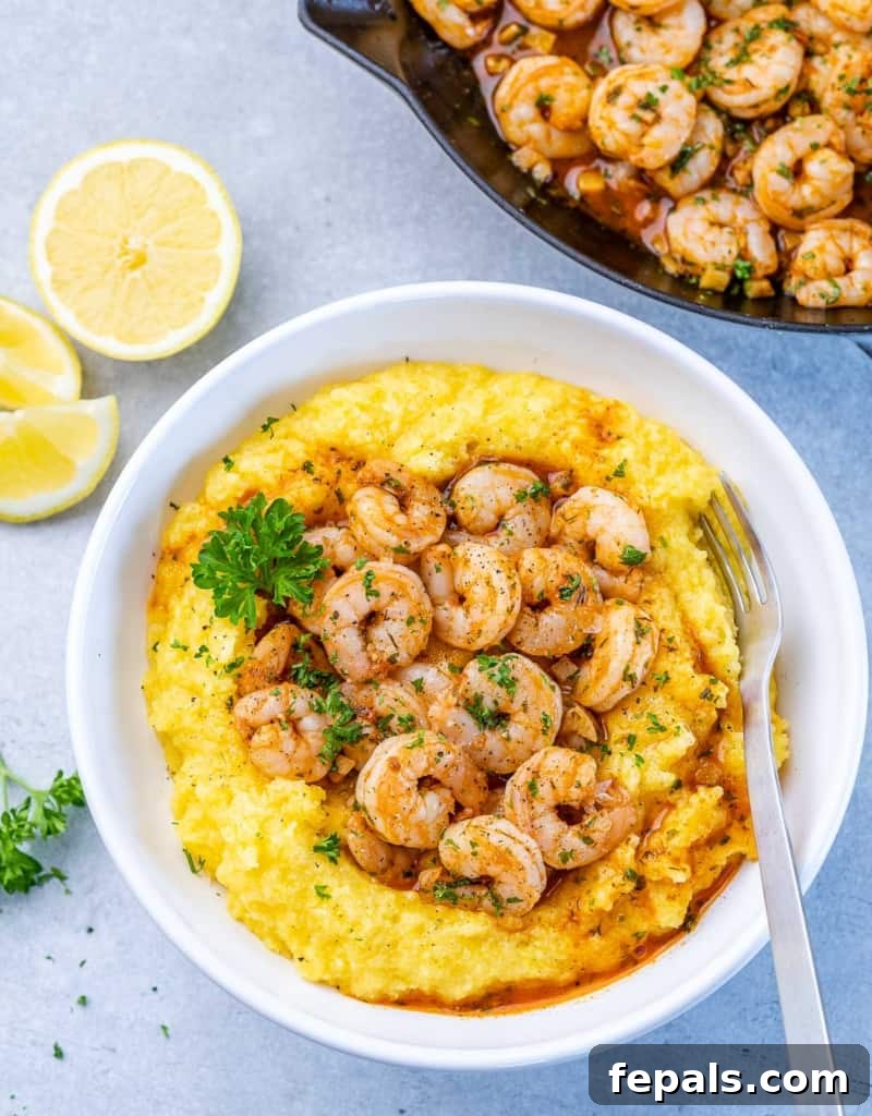 Golden Grits and Gulf Delights 11 top view of a white bowl with yellow looking grits topped with shrimp