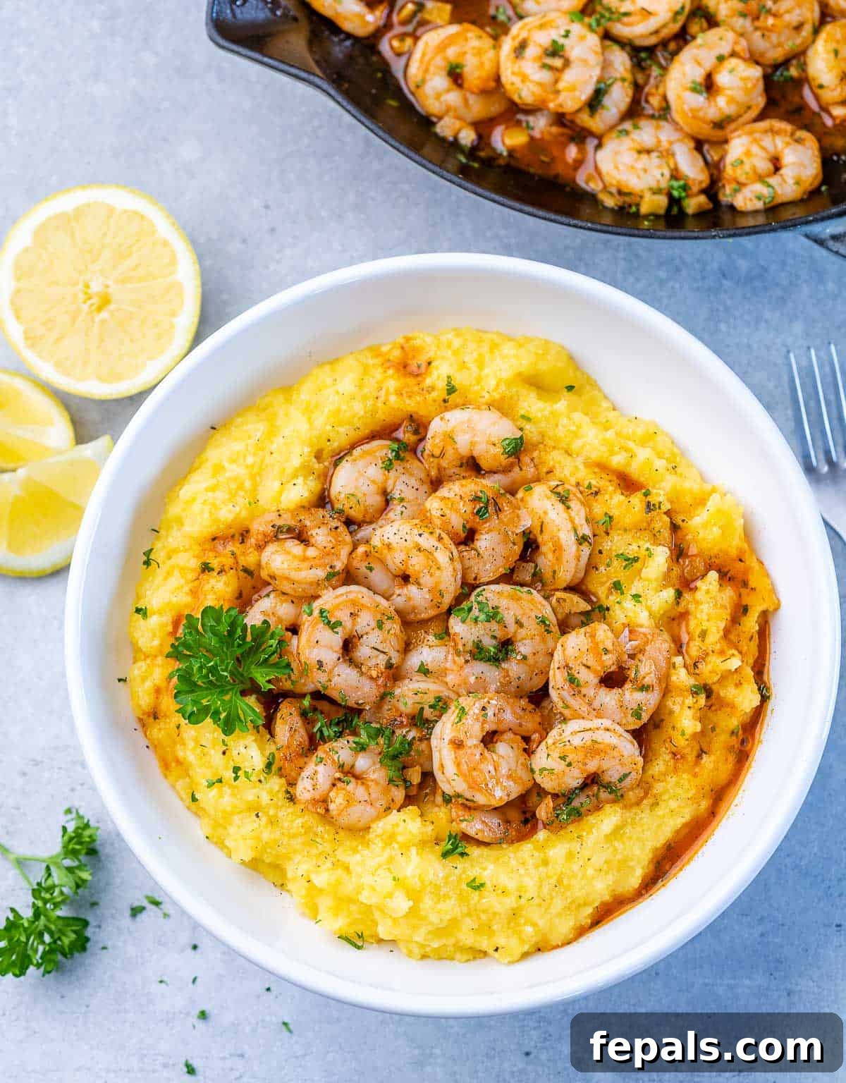 Golden Grits and Gulf Delights 10 Shrimp and grits near fresh lemon and parsley.