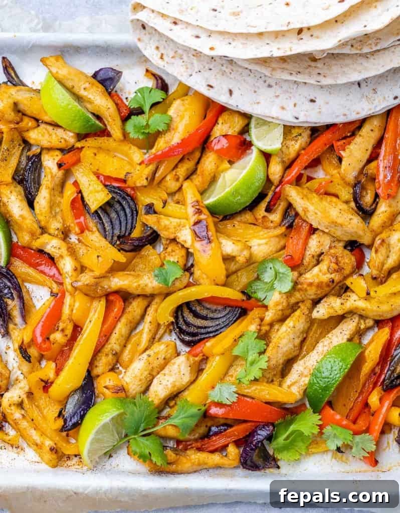 Top view chicken fajitas on a pan.