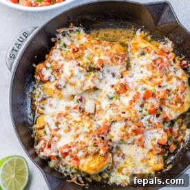 Zesty Salsa Fresca Chicken Bake 11 top view baked chicken breast topped with salsa and melted cheese