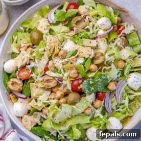 top view salad with mozzarella pearls on a round bowl, a perfect representation of the dish