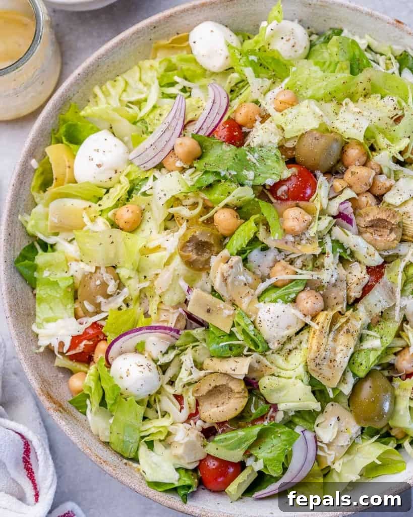 Zesty Italian Chop 9 top view chopped salad in a white dish, styled elegantly