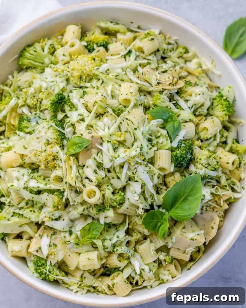 Zesty Green Goddess Pasta Salad 2 Top view of vibrant green pasta salad featuring various green vegetables and pasta
