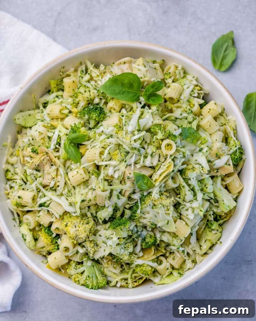 Zesty Green Goddess Pasta Salad 3 Top view of green pasta salad with broccoli, artichoke, and shredded cabbage