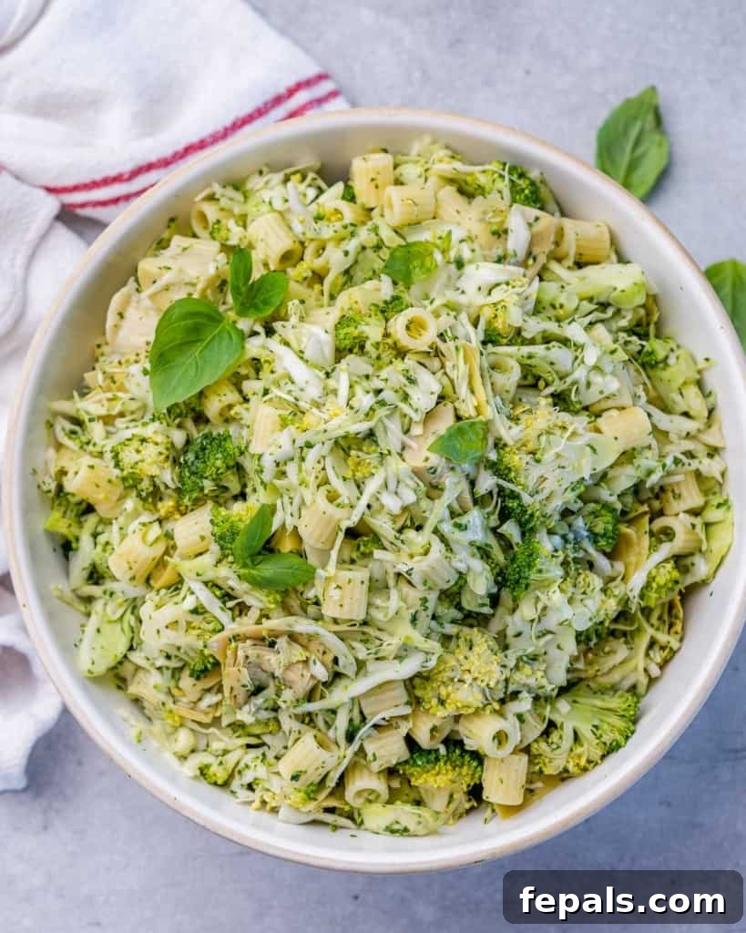 Zesty Green Goddess Pasta Salad 9 Top view of green pasta salad in a round white bowl, ready to be served.