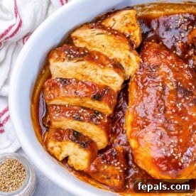 Sticky Honey Sriracha Chicken 14 Sliced baked chicken breast in an orange sauce topped with sesame seed