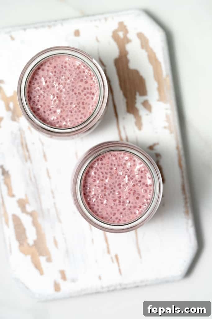 raspberry chia pudding mix portioned into jars for individual servings