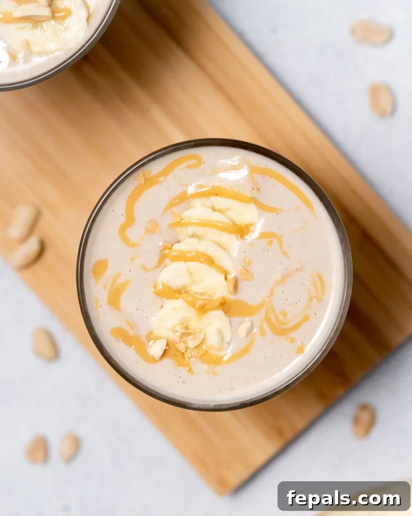 Nutty Banana Bliss Smoothie 2 Peanut butter banana smoothie topped with banana slices and drizzled with peanut butter.